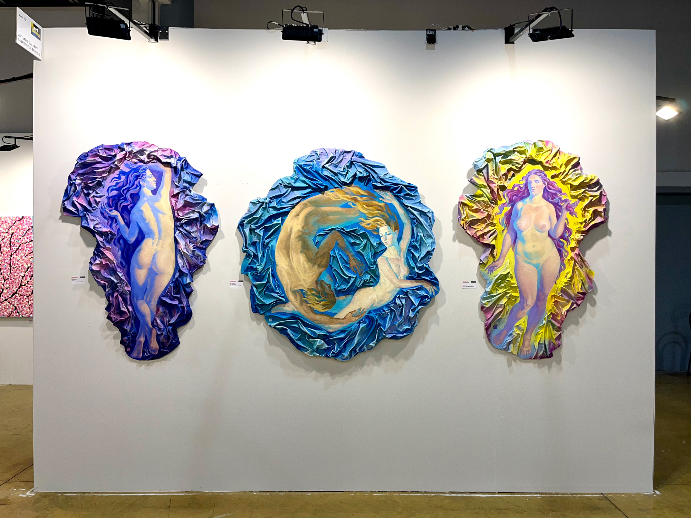 triptych of paintings sorrounded by waves, with moon, a lady from back in a purple aura and dusk with a lady in frontin lightening aura. at the sides and in the center the armony of love with 2 lovers in a blue circle