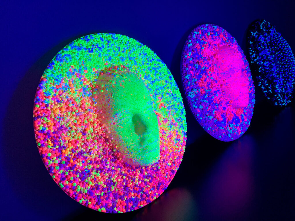 the 3 masks in high relief in line show the transformation of the human face.