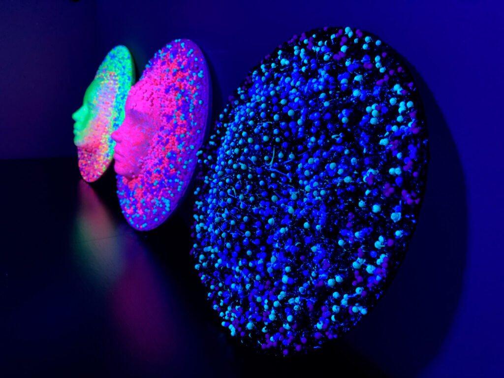 the 3 masks in high relief in line show the transformation of the human face.